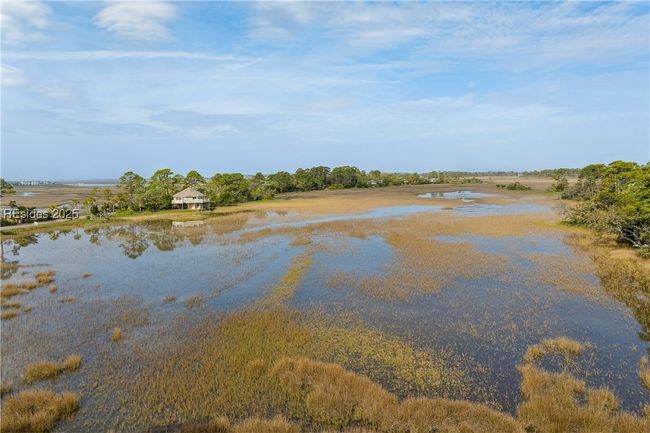 Hightide water view in front of home beyond the berm. | Image 60