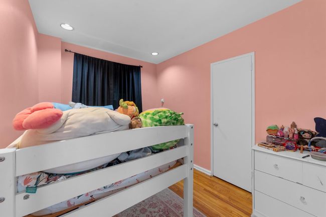 Bedroom with baseboards, recessed lighting, and light wood-style floors | Image 20