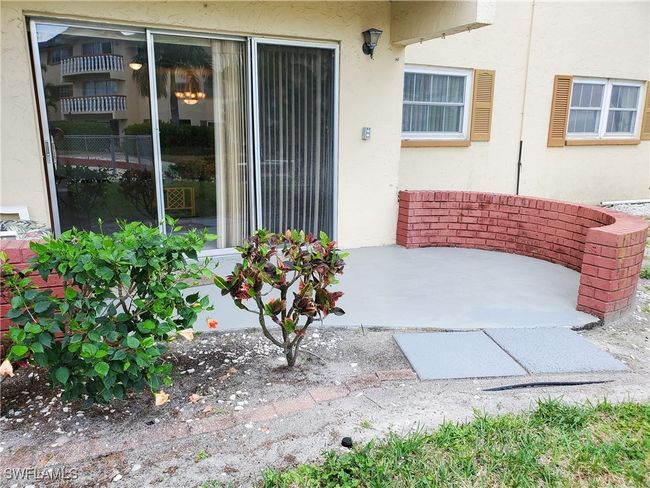 Doorway to property featuring a patio area and stucco siding | Image 22