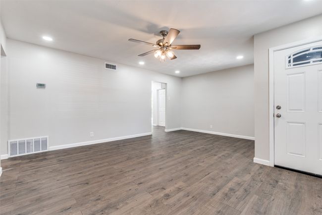 Foyer entrance with a ceiling fan, recessed lighting, and dark wood-type flooring | Image 5