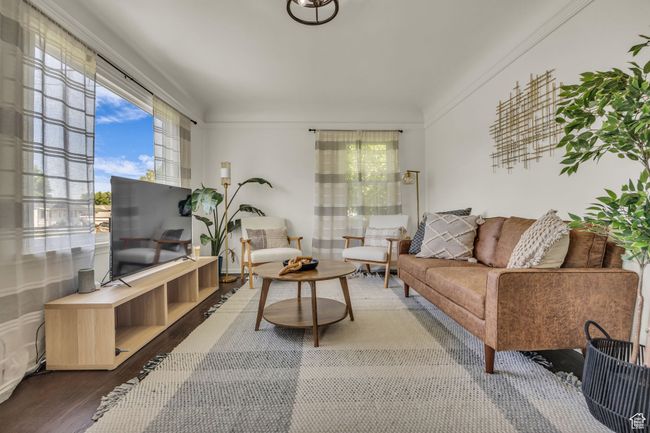 Living area featuring plenty of natural light and wood finished floors | Image 5