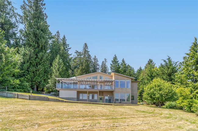 Rear view of house featuring a wooden deck | Image 64