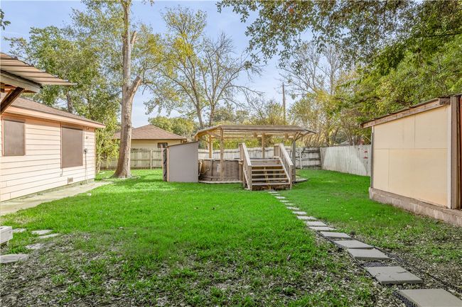 View of yard featuring a storage shed | Image 21