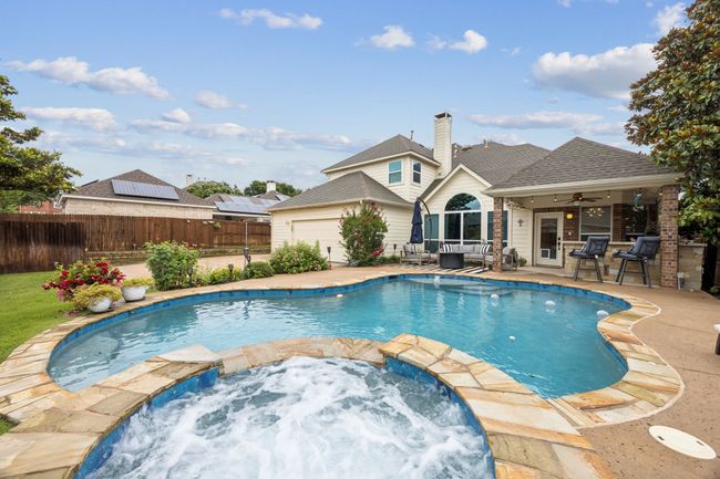 View of swimming pool and spa and outdoor kitchen and patio area | Image 31