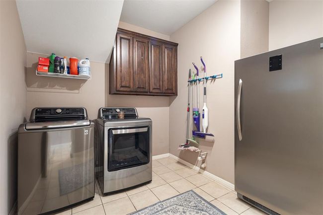 Full size wash room with plenty of space for all of your essentials and a refrigerator. | Image 32