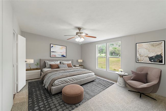 Bedroom with ceiling fan and carpet floors | Image 4