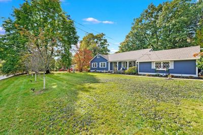 Ranch-style home with a front yard | Image 2