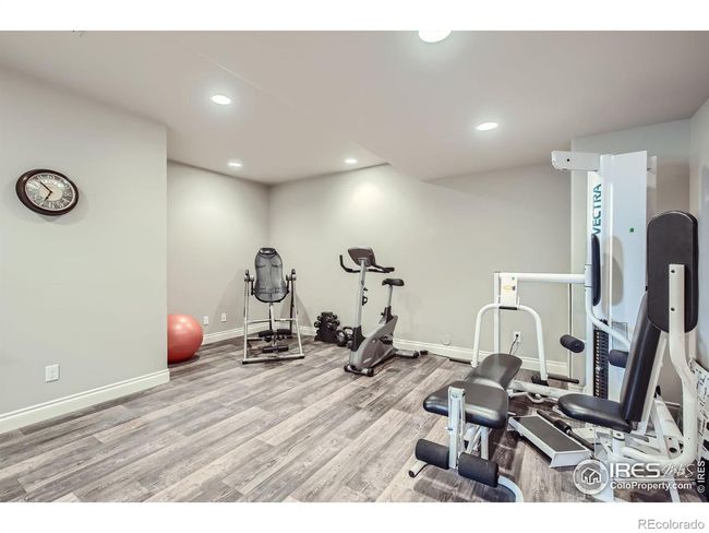 Basement rec room wet bar with wine refrigerator, dishwasher and built in microwave | Image 27