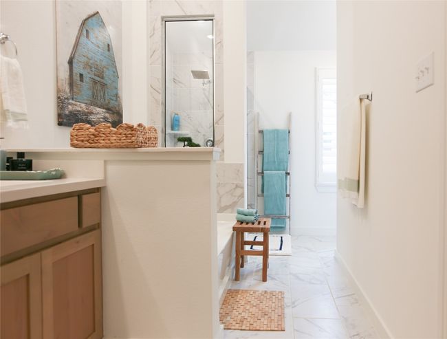 Bathroom featuring marble finish flooring, a marble finish shower, vanity, and a bathtub | Image 28