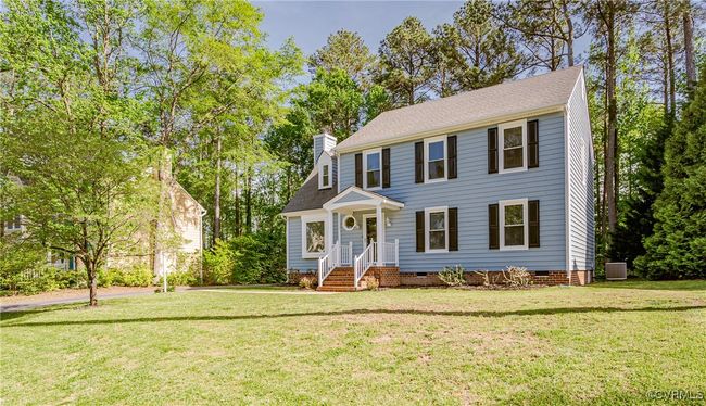 Colonial-style house featuring crawl space, a front lawn, central AC unit, and a chimney | Image 50