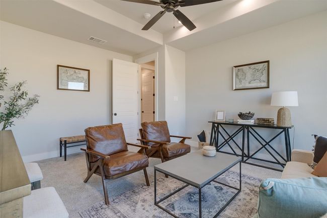 Living room with ceiling fan and light colored carpet | Image 27
