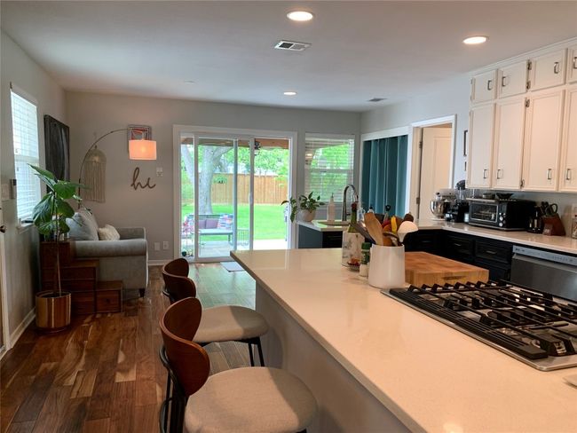 Sliding glass doors to the back let in lots of natural light. Photo from previous listing. | Image 6