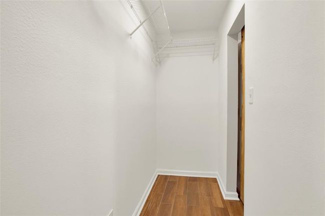 Internal view of walk in closet space | Image 17