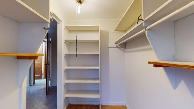 Bedroom walk in closet. | Image 14