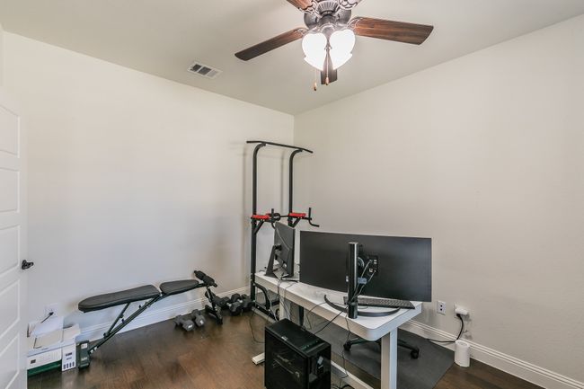 Office space with visible vents, baseboards, and wood finished floors | Image 35
