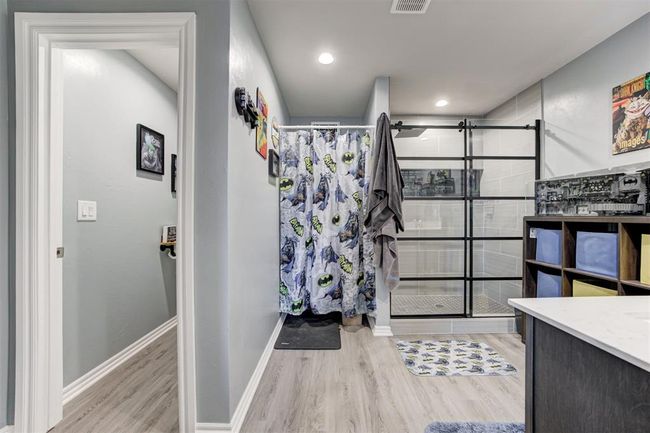 Full bathroom with a stall shower, wood finished floors, and vanity | Image 24