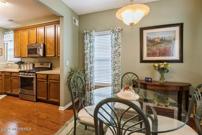 Adjacent breakfast room, perfect for casual dining. | Image 11