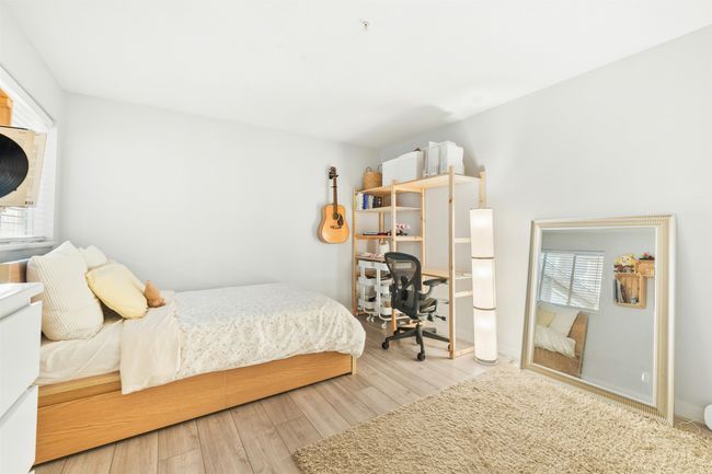 Bedroom with wood finished floors | Image 19