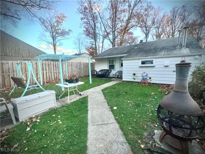 View of yard featuring a patio and a pergola | Image 3