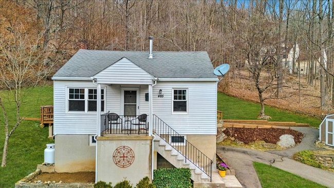 View of front of property with a chimney, a shingled roof, and a front lawn | Image 24