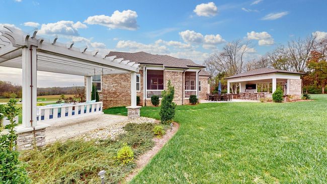 Enjoy privacy, space, and endless possibilities on this beautifully landscaped lot—over an acre with multiple outdoor living areas, perfect for entertaining, relaxing, and soaking in the views. | Image 62