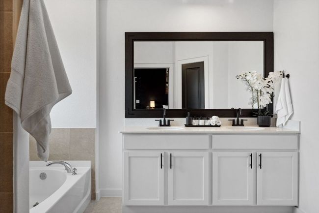 The ensuite is equipped with a spacious dual vanity. | Image 21