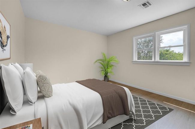 Bedroom with hardwood / wood-style flooring | Image 36