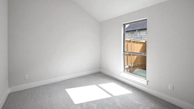 Carpeted spare room with baseboards and vaulted ceiling | Image 17