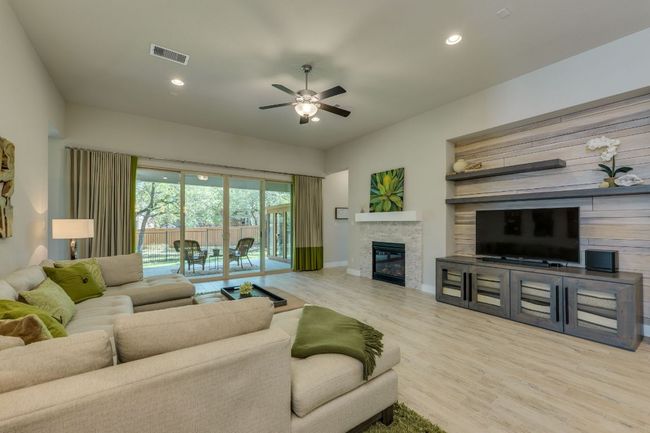 Living area with gas fireplace and sliding doors | Image 18