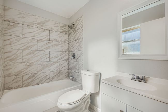 Full bathroom featuring vanity and shower / bathtub combination | Image 6