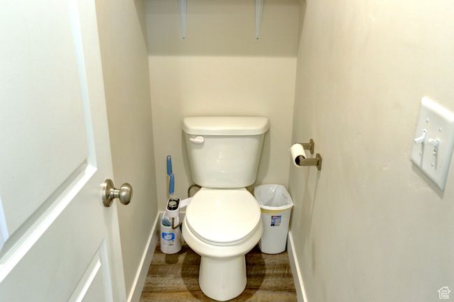 Bathroom with baseboards and toilet | Image 16