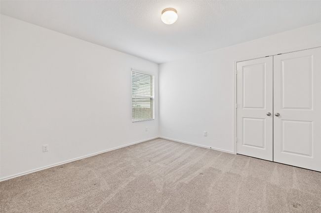 Unfurnished bedroom featuring carpet floors and a closet | Image 29