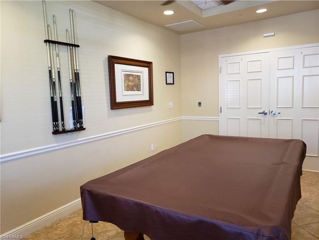 Recreation room with baseboards, recessed lighting, pool table, and tile patterned floors | Image 40