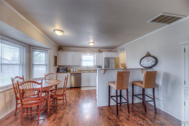 Open kitchen with bar and bay window breakfast nook | Image 8