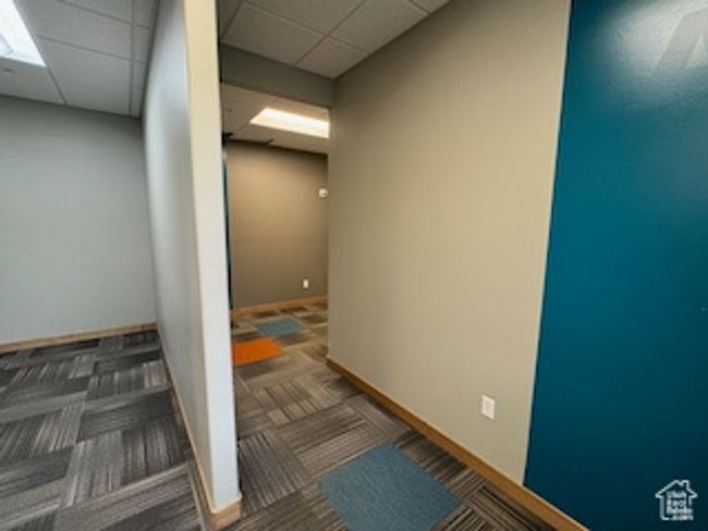Corridor featuring carpet and a paneled ceiling | Image 43