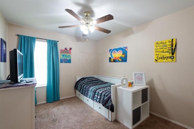 Carpeted bedroom with baseboards and a ceiling fan | Image 21