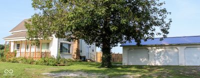 Detached garage with side door entrance into the kitchen. | Image 1