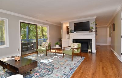 Living room with ornamental molding and hardwood / wood-style floors | Image 3