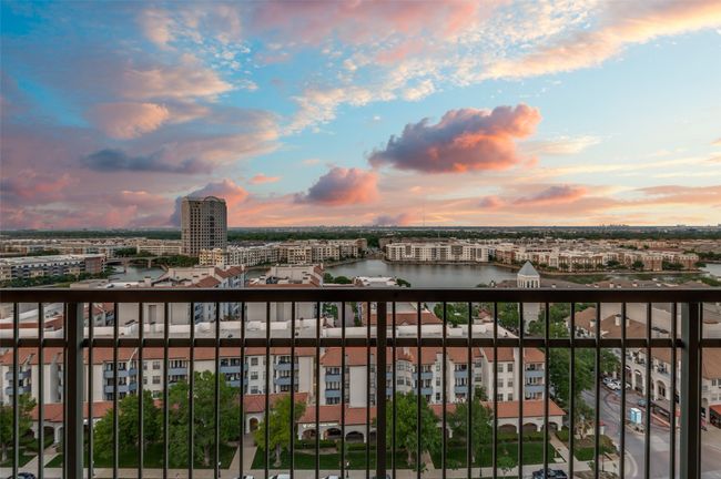 Balcony at dusk featuring a city view | Image 11
