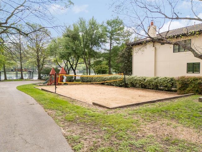Your own private boat launch and Greenshores two story day dock. View of property's community featuring beach volleyball court, there is also a playscape and picnic area, plenty of parking to park trailer and watercraft. Your own boat ramp access into Lake Austin and a two story day dock to lounge and enjoy Lake Austin | Image 39