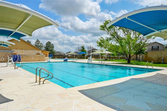 Community pool with a patio area | Image 18
