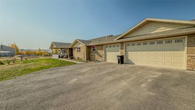 View of front facade featuring a garage and a front yard | Image 3