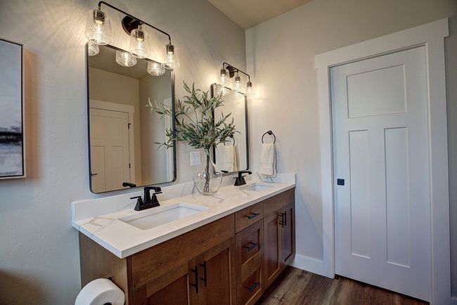Full bathroom featuring double vanity and dark wood finished floors | Image 27