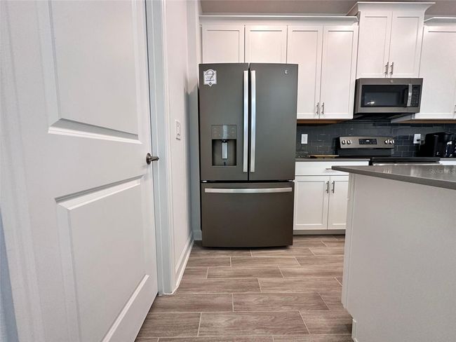 11455 Listening Drive, Townhouse with 4 bedrooms, 3 bathrooms and null parking in ORLANDO FL | Image 4