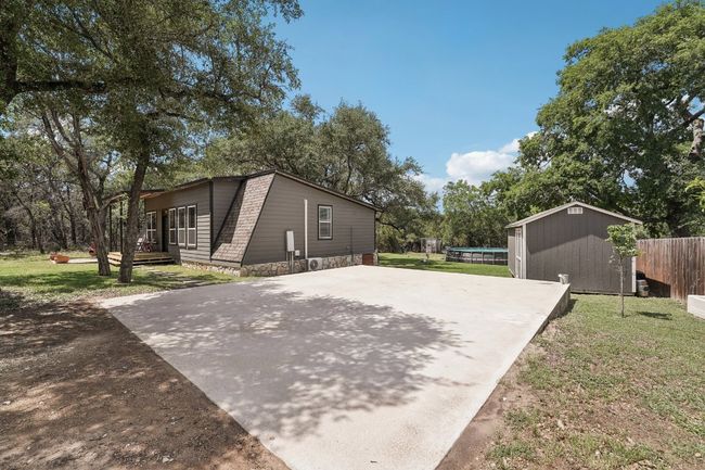 View of side of home with concrete driveway | Image 4