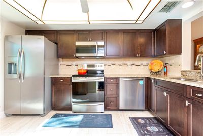 Kitchen with stainless steel appliances. | Image 3