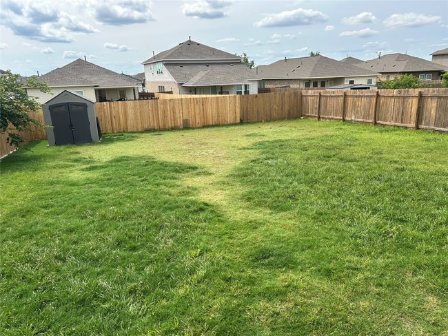 View of yard with a residential view | Image 14