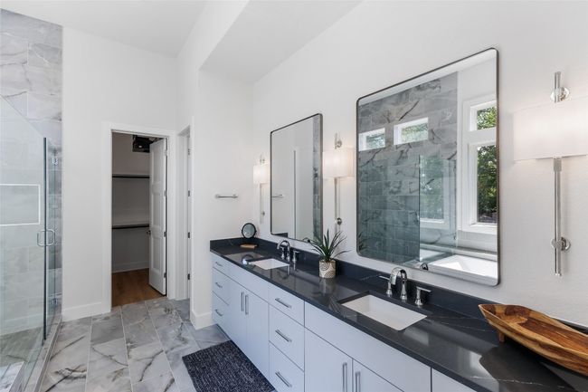 Primary bathroom en-suite has Milestone Onyx & Anatolia Mosaic Tile. | Image 24