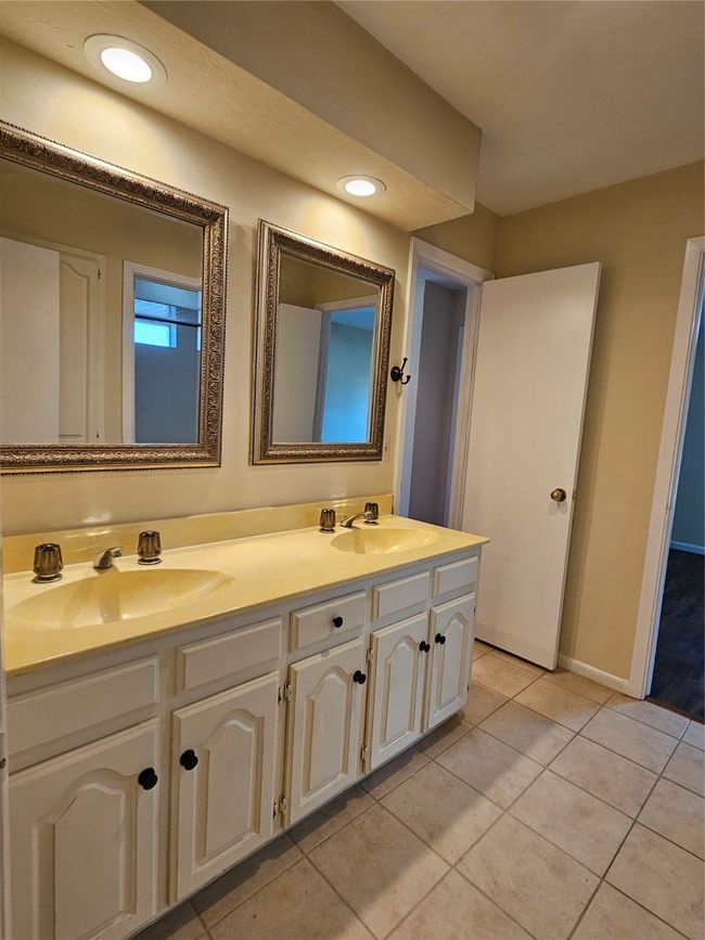 Full bathroom featuring double vanity and tile patterned flooring | Image 9