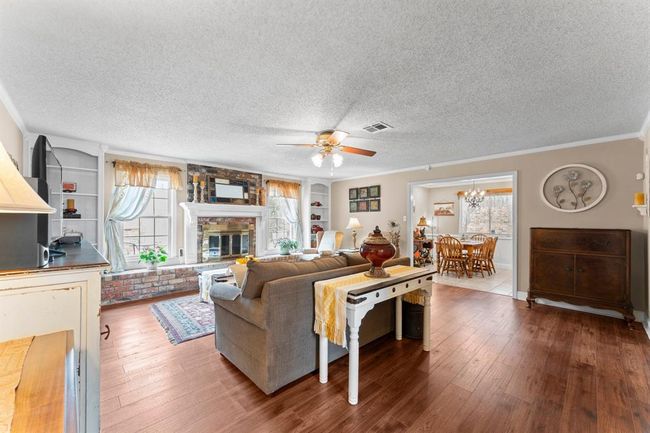 The kitchen and dining area are away from all bedrooms. | Image 7
